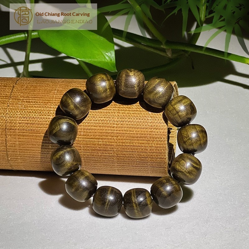 2.0 cm diameter Golden Nanmu and Ebony wood beaded bracelet with water ripple pattern.