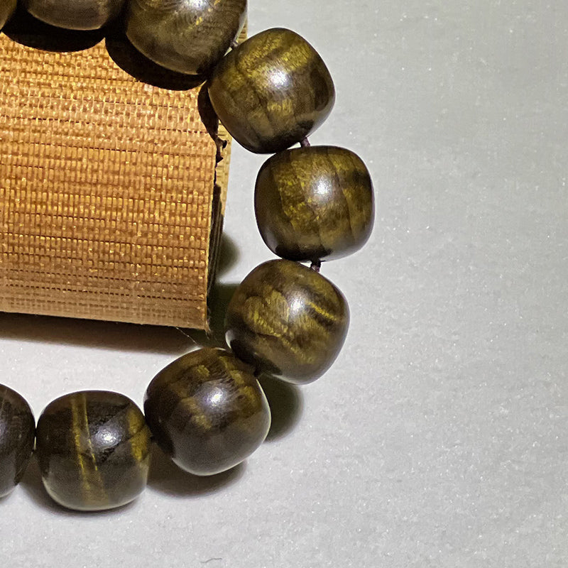 2.0 cm diameter Golden Nanmu and Ebony wood beaded bracelet with water ripple pattern.