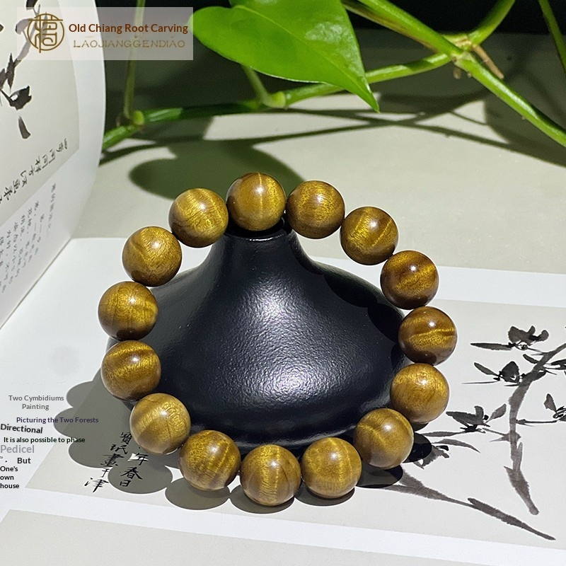1.5 cm genuine golden nanmu wood bracelet with water ripple pattern.