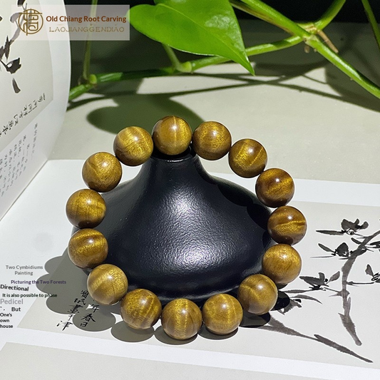 1.5 cm genuine golden nanmu wood bracelet with water ripple pattern.