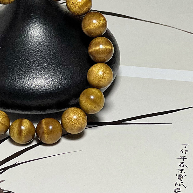 1.2cm genuine golden nanmu wood prayer beads, made from aged wood with a water ripple pattern.