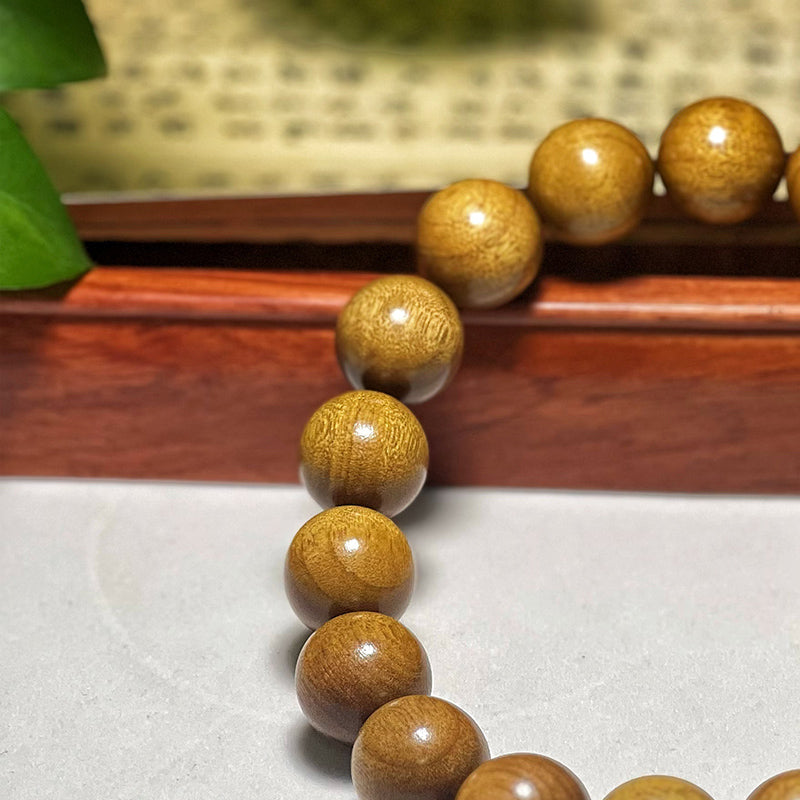 2.0 Authentic Golden Nanmu Wood Bracelet, featuring shifting patterns and made from aged, collectible wood.