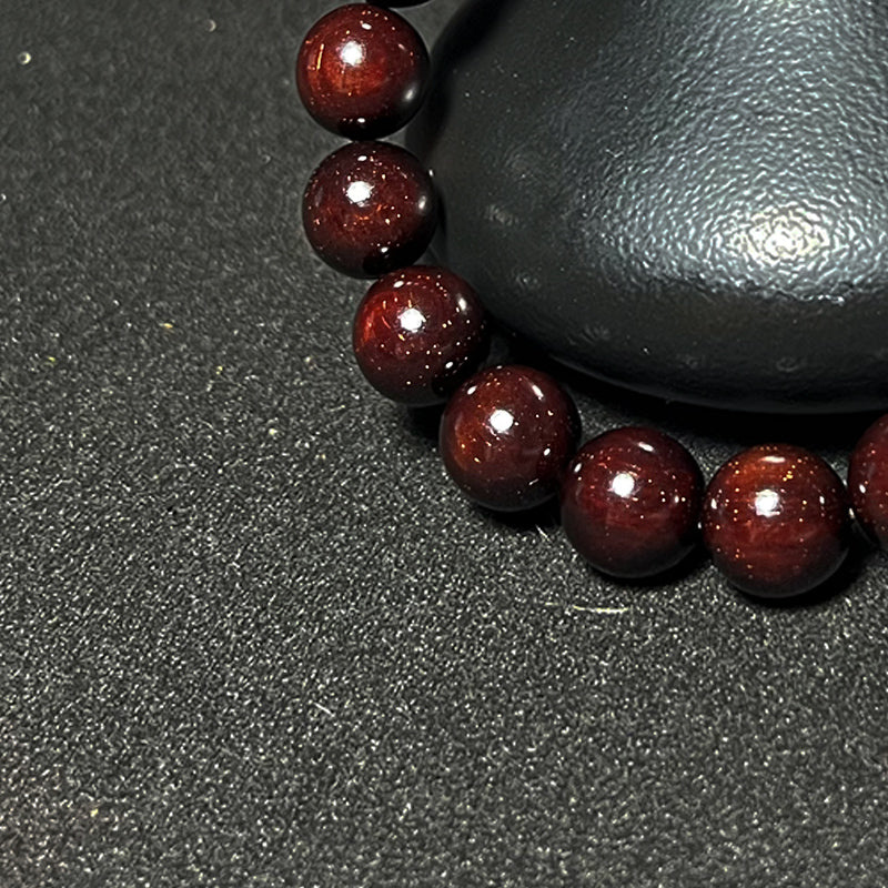 1.2 Genuine Indian rosewood bracelet with many golden flecks.
