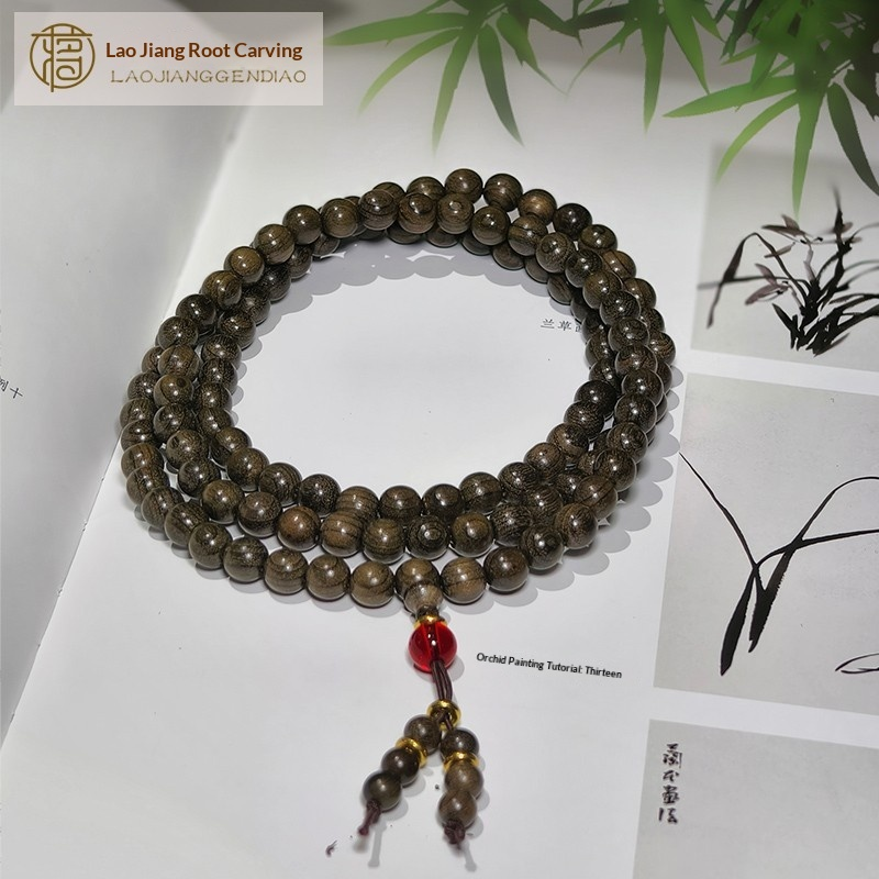 0.8 Genuine solid wood golden nanmu wood bracelet with 108 beads of submerged wood.