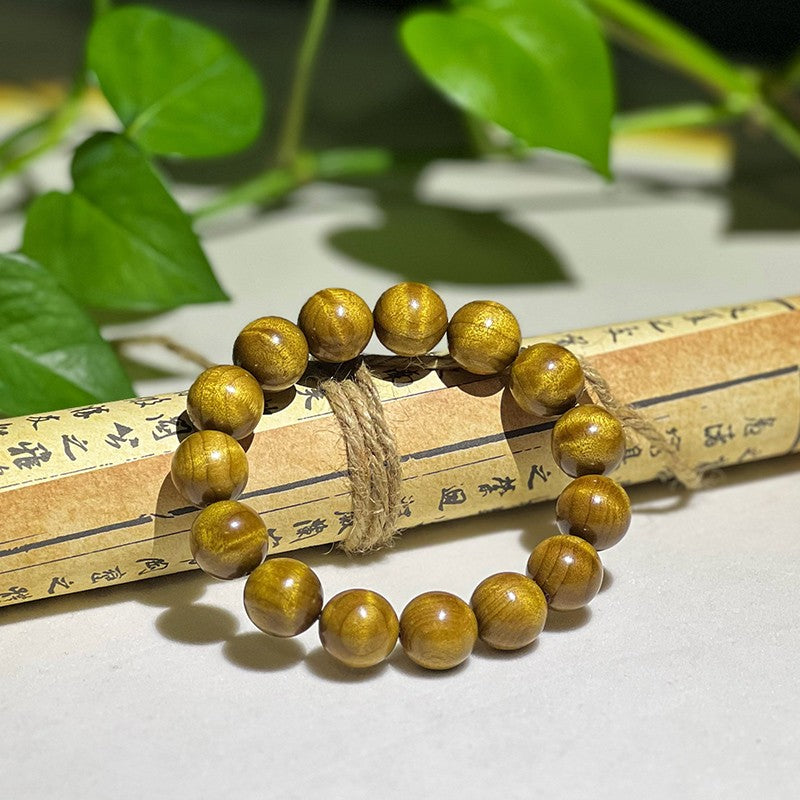 1.5cm Golden Nanmu wood bracelet with subtle ripple patterns