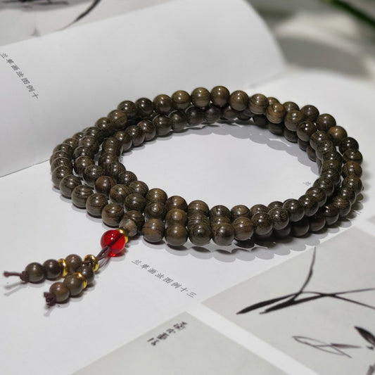 0.8 Genuine solid wood golden nanmu wood bracelet with 108 beads of submerged wood.