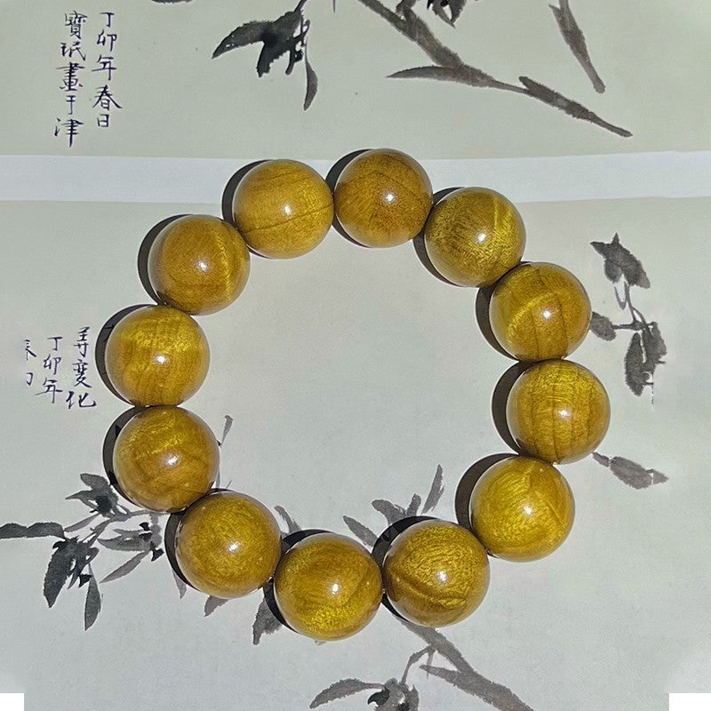 2.0 Phoebe zhennan wood bracelet with a shifting effect, made from old wood.