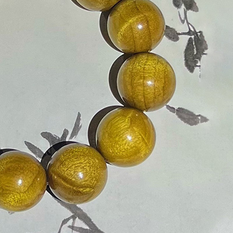 2.0 Phoebe zhennan wood bracelet with a shifting effect, made from old wood.