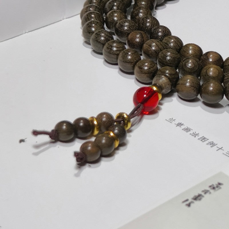 0.8 Genuine solid wood golden nanmu wood bracelet with 108 beads of submerged wood.