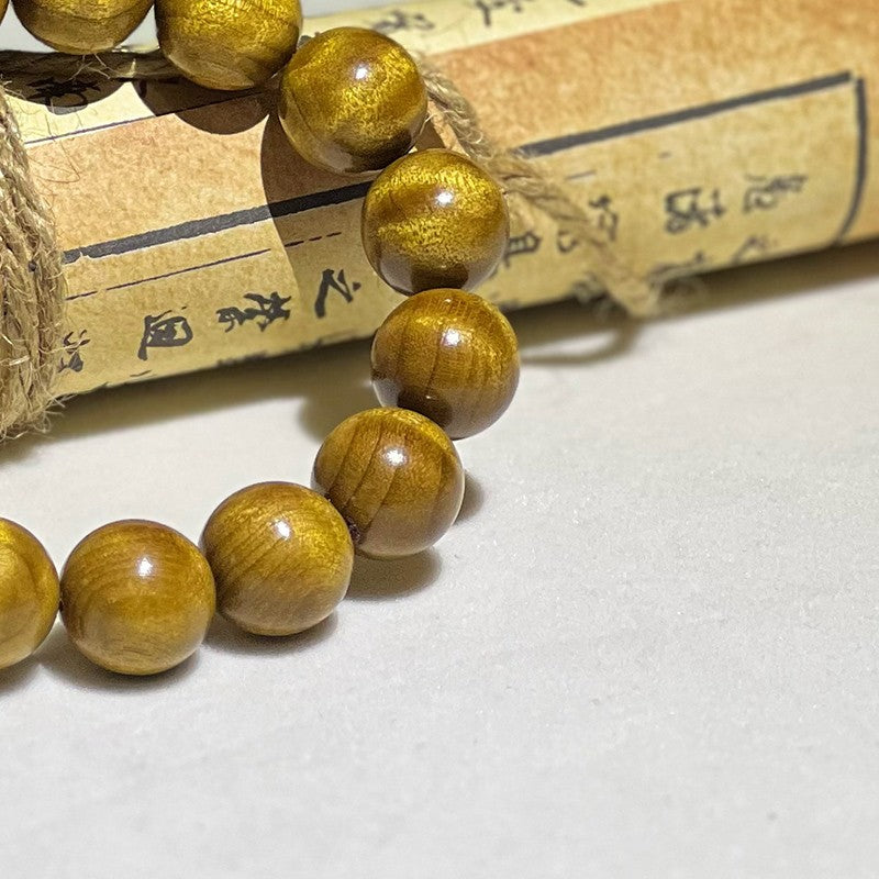 1.5cm Golden Nanmu wood bracelet with subtle ripple patterns